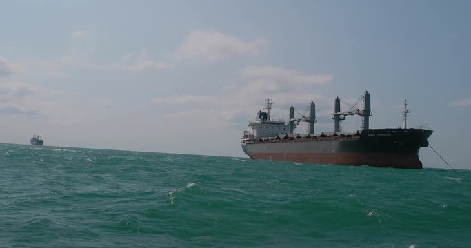 The cargo ship is in the roadstead