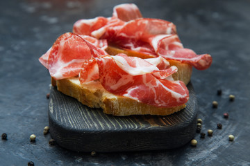 A sandwich with Parma ham. Ciabatta.