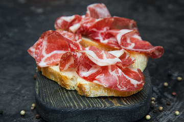 A sandwich with Parma ham. Ciabatta.
