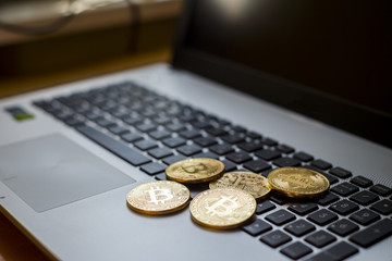 Golden bitcoin on keyboard