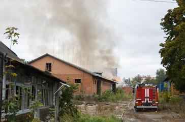 Fototapeta na wymiar the fire in warehouses firefighters arrived