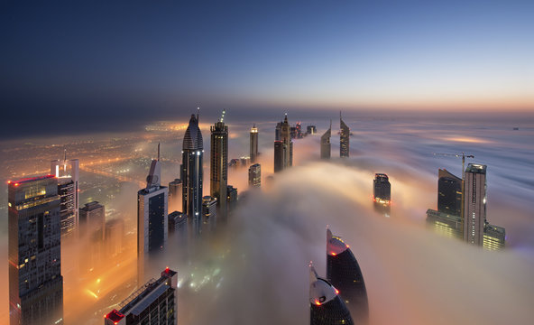 Dubai tall buildings above the cloud layer, 