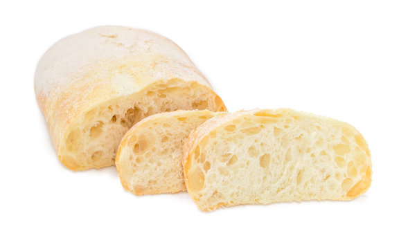 Partly sliced ciabatta on a white background