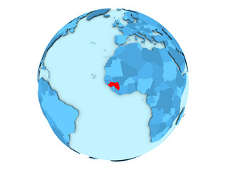 Guinea on blue globe isolated