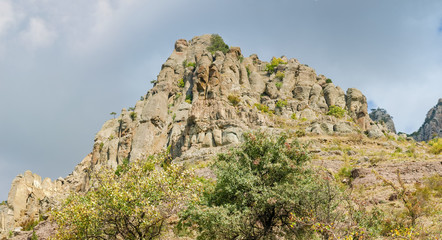 Fototapeta na wymiar Panorama of the hillside with weathered rocks