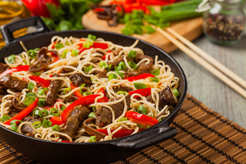 Chinese pasta with beef. Prepared in wok.
