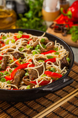 Chinese pasta with beef. Prepared in wok.