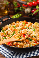 Fried rice with chicken. Prepared and served in a wok.