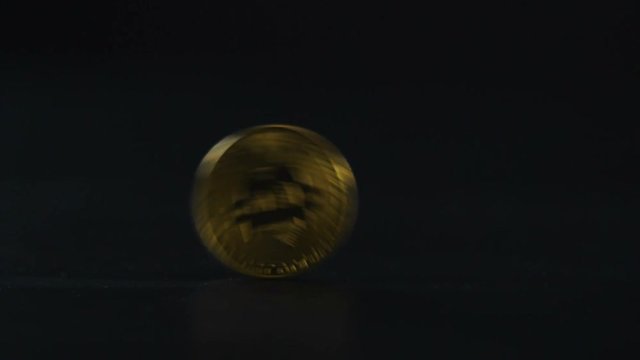Rolling gold and silver bitcoins.