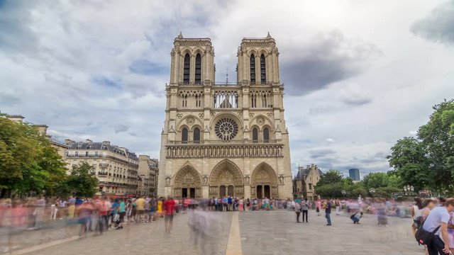 Front view of Notre-Dame de Paris timelapse hyperlapse, a medieval Catholic cathedral on the Cite Island in Paris, France