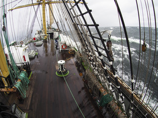 wild weather at sea on an old tallship, traditional sailing vessel © flyingwalrus