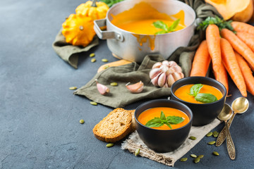Fall autumn roasted orange pumpkin carrot soup with garlic