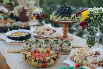  Outdoors fourchette table with traditional moldavian appetizers and fresh flowers © niromaks