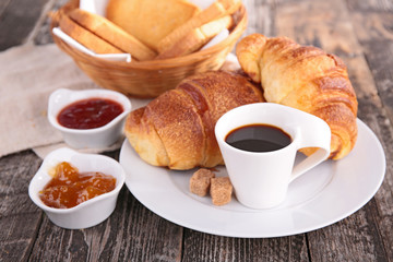 breakfast with coffee cup and croissant