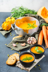 Fall autumn roasted orange pumpkin carrot soup with garlic