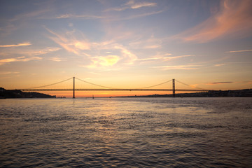 Fototapeta na wymiar ponte 25 de abril bridge lisbon portugal with sundown