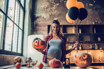 Woman with Halloween pumpkin