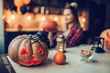 Woman with Halloween pumpkin