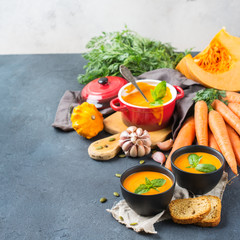 Fall autumn roasted orange pumpkin carrot soup with garlic