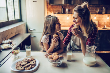 Mom with daughter on kitchen