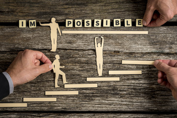 People making impossible letter tile sign into possible