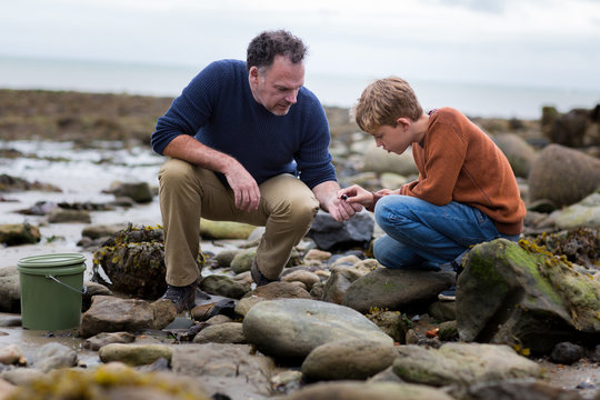 Father teaching Son how to fish