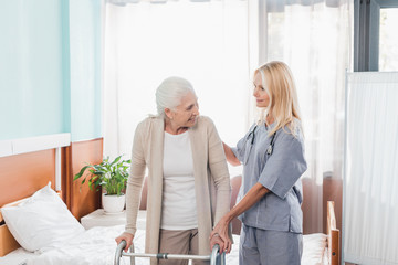 nurse and senior patient with walker