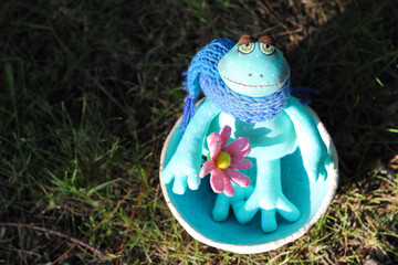 Soft textile art doll toy enamored boy frog-groom with pink flower. Wedding concept