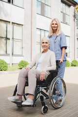 Fototapeta na wymiar nurse and senior woman in wheelchair