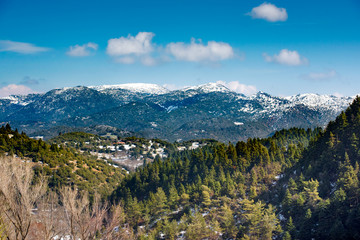 A wide-angle sunny,autumn midday view of snow coated Helmos mountain which located in Peloponnese. Grecce