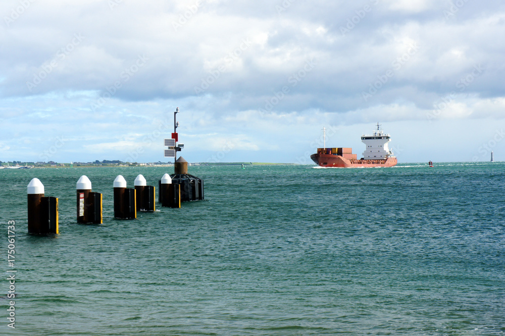 Wall mural the cargo ship arrives at carlingford lough.