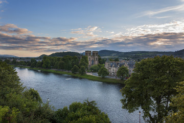 Fototapeta na wymiar Inverness, Scotland - August 14, 2010: View of the city of Inverness from the banks of the Ness River in Scotland, United Kingdom