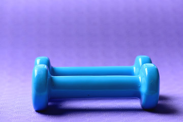 Healthy shape and sport concept. Barbells made of plastic