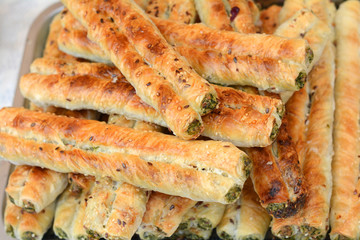 Puff pastry with filling. Rollini with brynza cheese and spinach