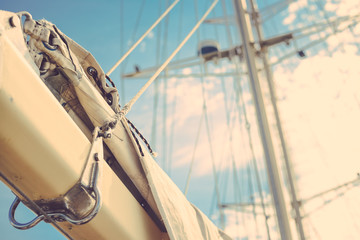 Vintage beautiful sail boat details. Rope, hull, rigging sailing yacht background