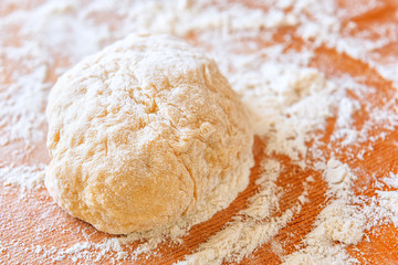 Fototapeta na wymiar fresh dough in flour