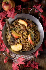 Fried liver with onion apple and herbs.