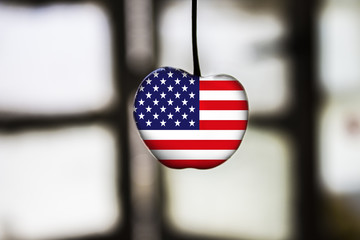 flag of USA painted on cherry or apple fruit