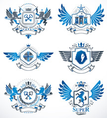 Fototapeta premium Collection of vector heraldic decorative coat of arms isolated on white and created using vintage design elements, monarch crowns, pentagonal stars, armory, wild animals.