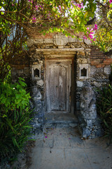 Fototapeta na wymiar Old wooden door near beach Sanur Bali