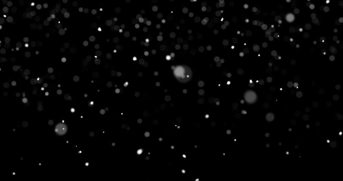 Looping snow flakes falling matte on black background with text space to place logo or copy. Compositable in screen or add blending. Animated abstract overlay. 4k seamless loop video