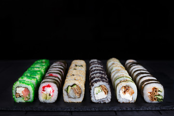 Great set of traditional uramaki and futomaki sushi rolls with wide assortment of fillings.  Free space for text design