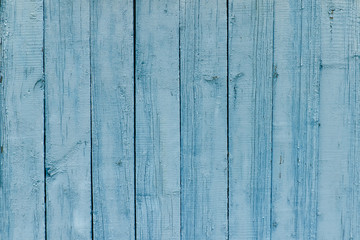 Fototapeta na wymiar Vertical wooden slats, old blue paint. Background