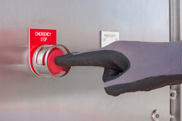 Technician operator push the emergency push button switch to stop compressor engine - obrazy, fototapety, plakaty