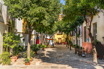 Typical street scene in Seville  - obrazy, fototapety, plakaty