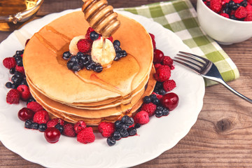 stack of pancakes with berries
