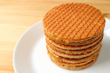 Stack of Stroopwafel on the White Plate Served on Wooden Table 