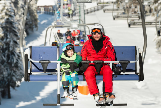 Father and son on ski lift