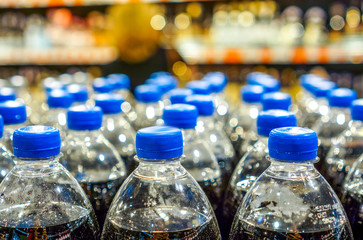 Many bottles with pepsi top view. background made by big pepsi bottles