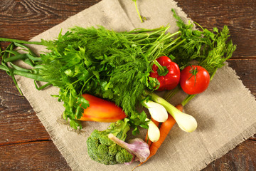 salad from fresh vegetables in a plate on a table, selective focus